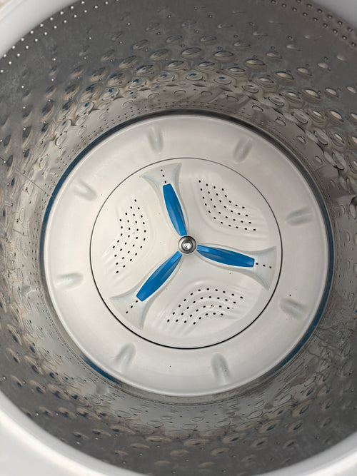 Inside view of Kenmore washer drum with blue impeller blades - no agitator design